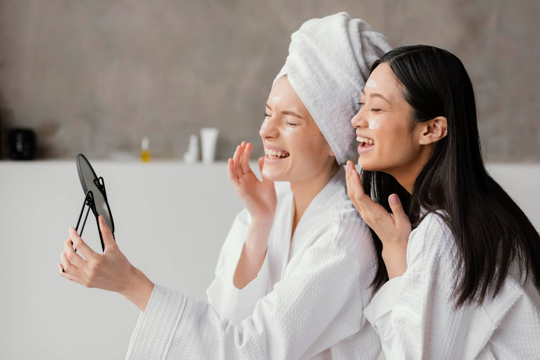 women applying skincare product on face